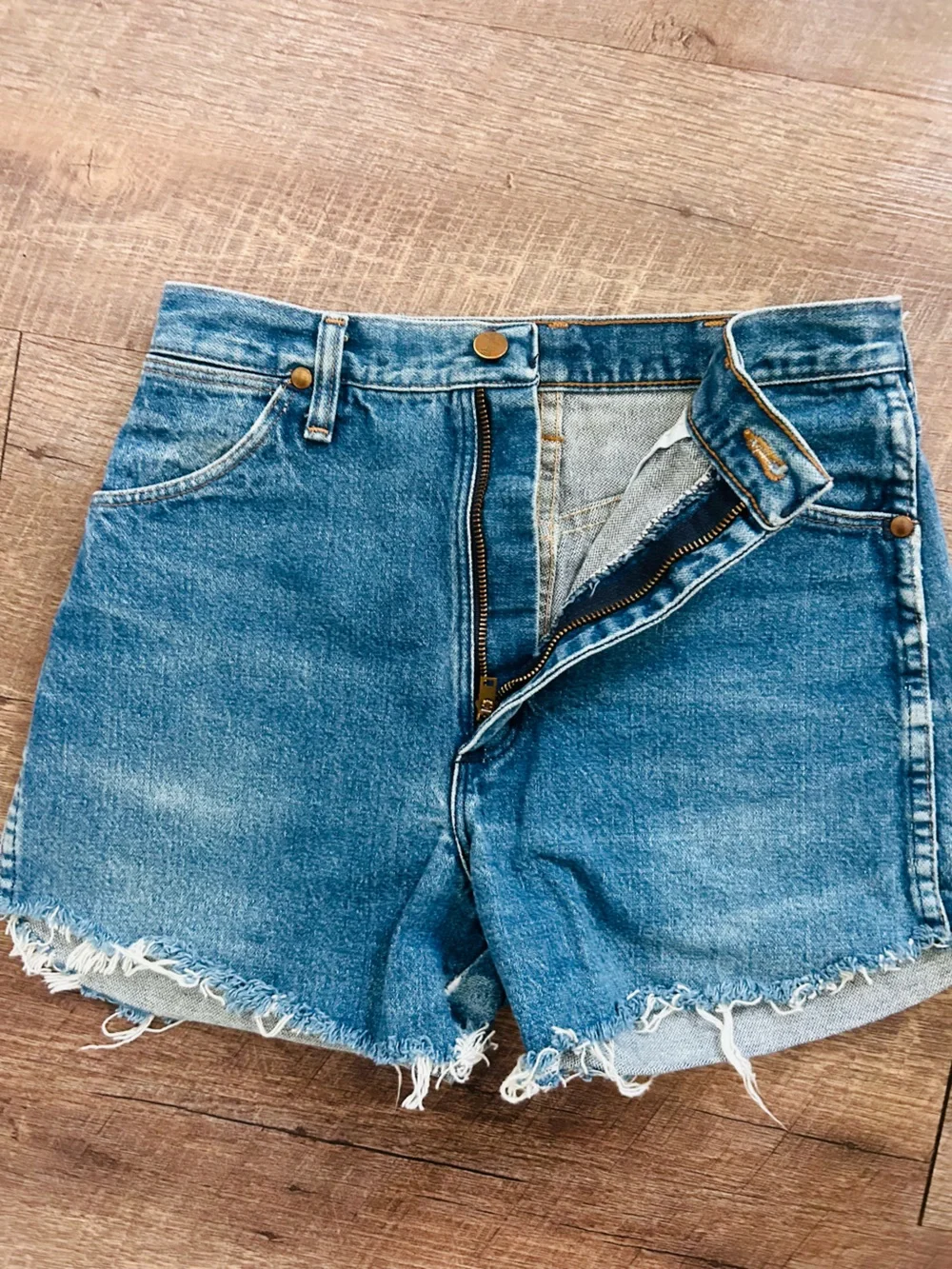 pair of vintage Wrangler high-rise cutoff denim shorts